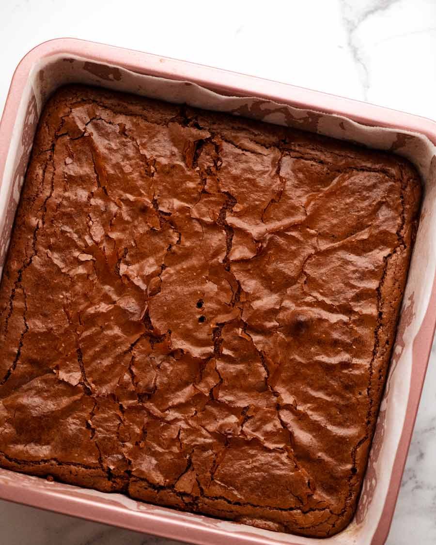 Overhead photo of Flourless Chocolate Brownies (gluten free) in a baking pan, fresh out of the oven