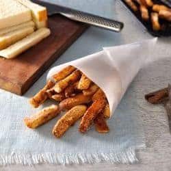 Cinnamon Sugar Bread Crust Treats in a paper cone