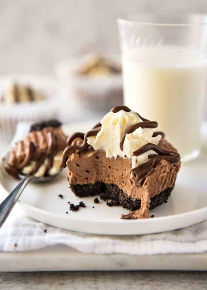 No Bake Nutella Cheesecake - Mini ones made in a muffin tin! A biscuit base and light mousse-like Nutella flavoured cheesecake. Easy to make and completely irresistible! recipetineats.com