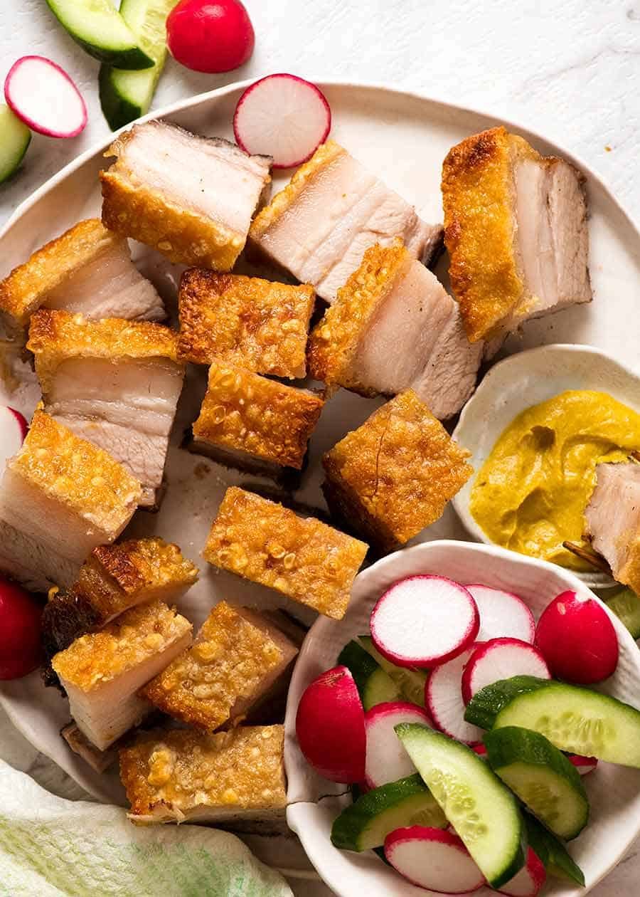 Plate of Chinese Crispy Pork Belly with the best crackling in the world. Pork belly slices on a plate, ready to be served