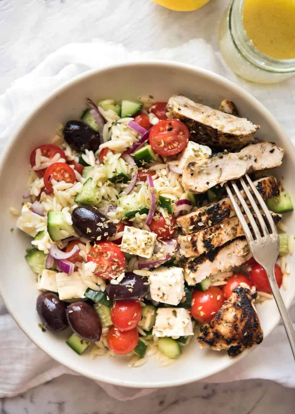 Greek Lemon Orzo Salad (Risoni) - All the fixings of a Greek Salad tossed through orzo / risoni and dressed with a gorgeous zesty lemon vinaigrette. www.recipetineats.com