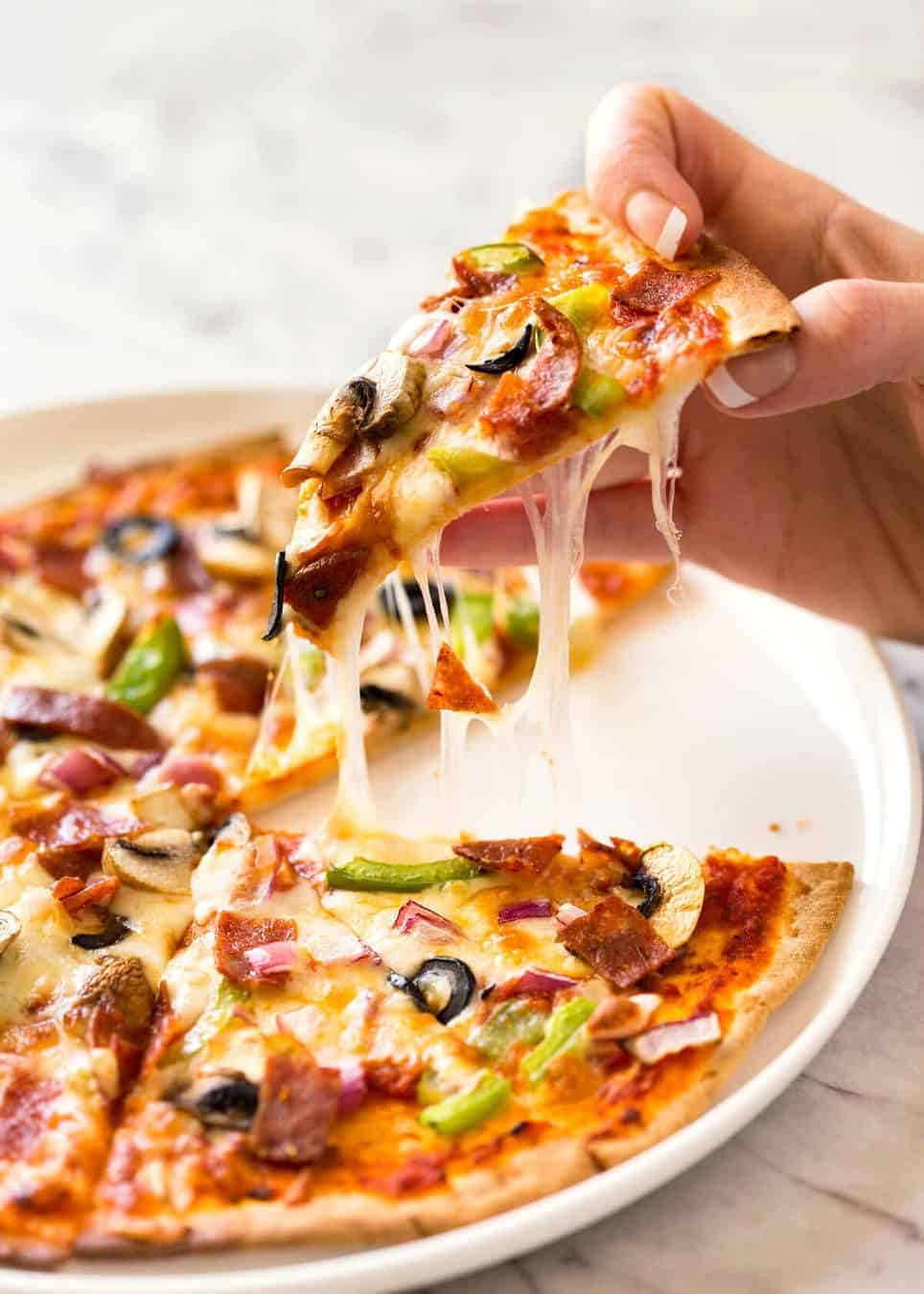 $2 Homemade Frozen Pizzas - quick and easy made using flatbreads, cook from frozen for a terrific Thin & Crispy pizza! www.recipetineats.com