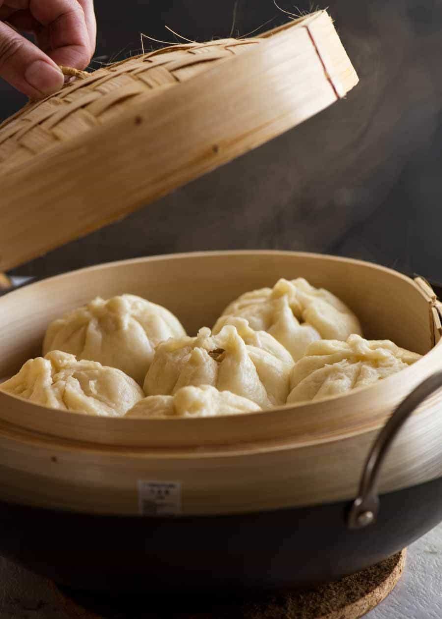 Freshly made Chinese Steamed Pork Buns in a bamboo steamer