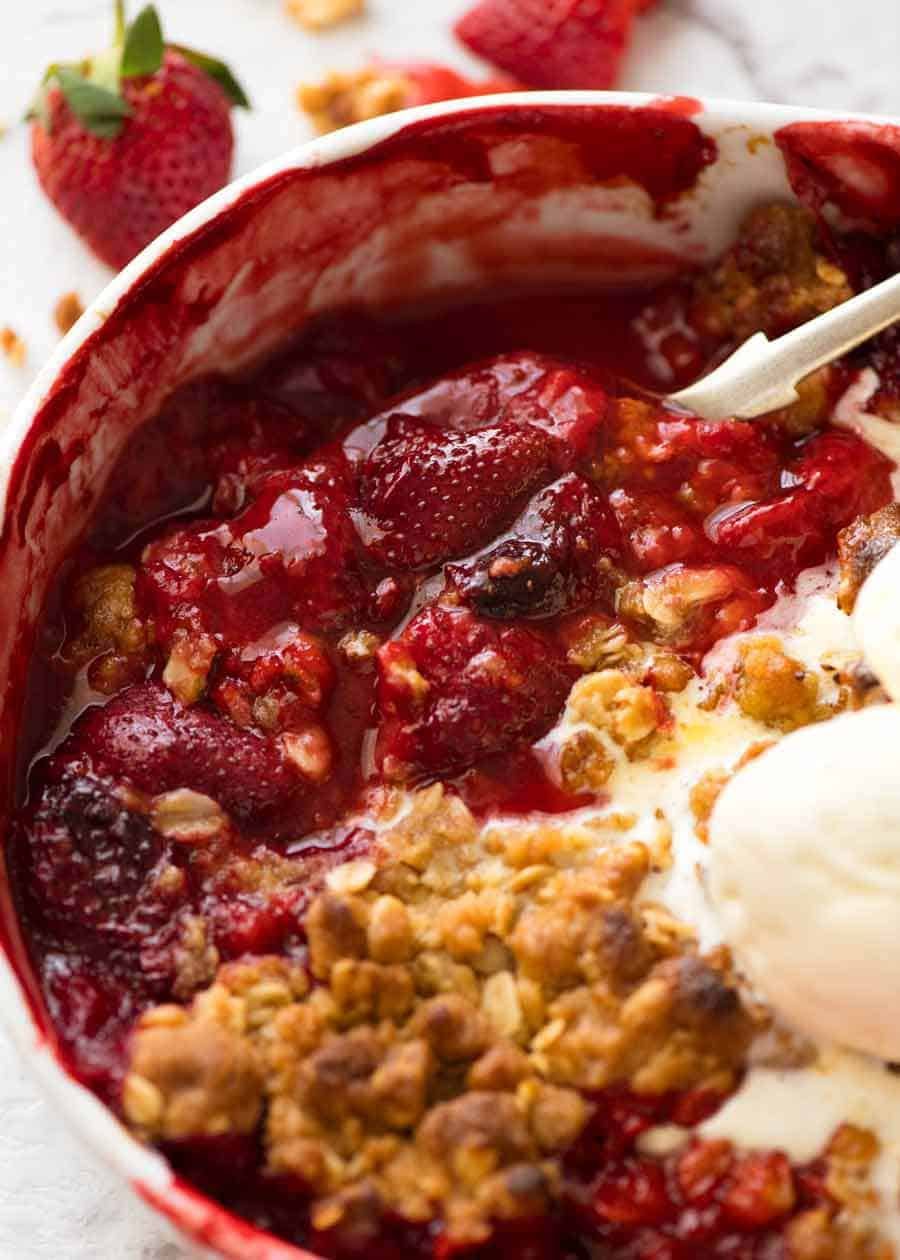 Close up showing the syrupy strawberry filling of Strawberry Crumble