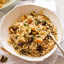 Rice Pilaf in a bowl with a spoon, ready to be eaten