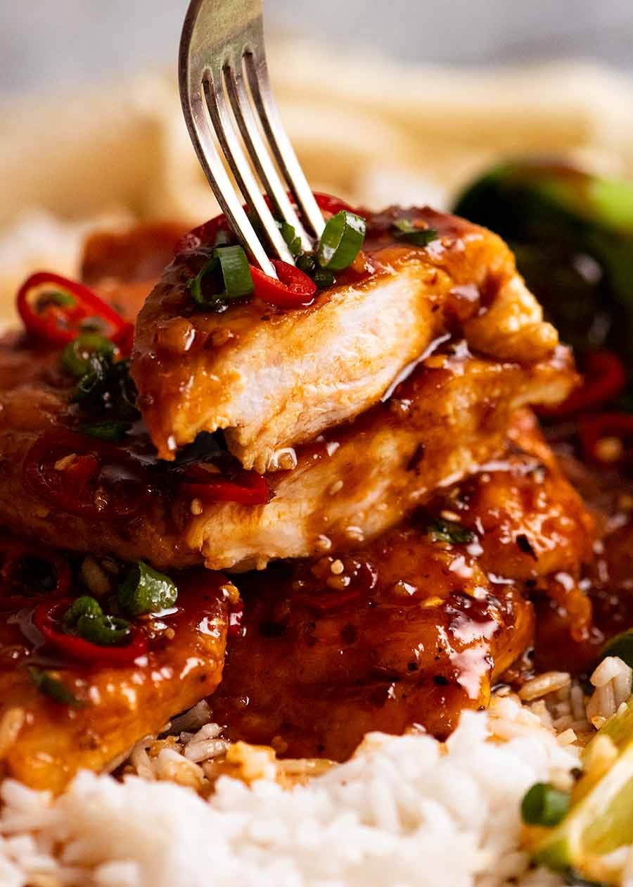 Fork picking up a piece of Asian Chilli Chicken